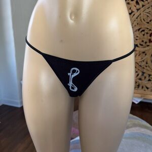 NWOT Black cotton blend low rise tong panties w/ graphic design on front